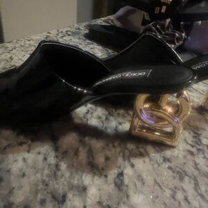 Dolce & Gabbana Black Patent Leather Mules with Gold Knot Heel